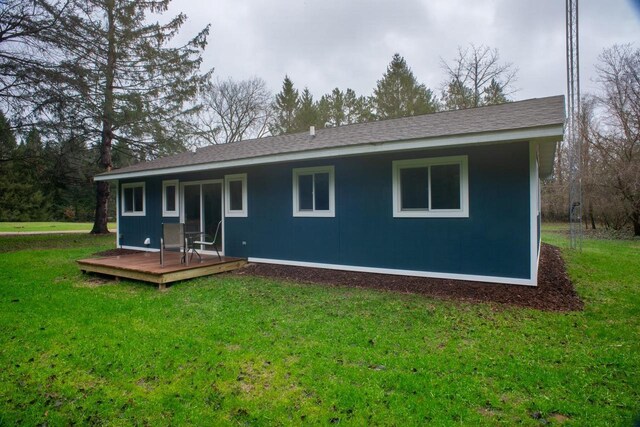 N3725 County Road Ee, Redgranite, WI 54970 - rear view of house with a deck, a lawn, and a shingled roof