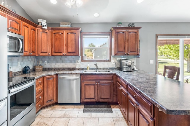 2891 Yellow Jasmine Way, Green Bay, WI 54313 - kitchen featuring stainless steel appliances, a sink, a peninsula, plenty of natural light, and recessed lighting