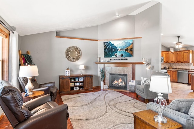 2891 Yellow Jasmine Way, Green Bay, WI 54313 - living area with lofted ceiling, a fireplace, and light wood-style floors