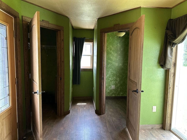 6111 Magnolia Dr, Wisconsin Rapids, WI 54494 - corridor featuring wood-type flooring, baseboards, and a textured ceiling