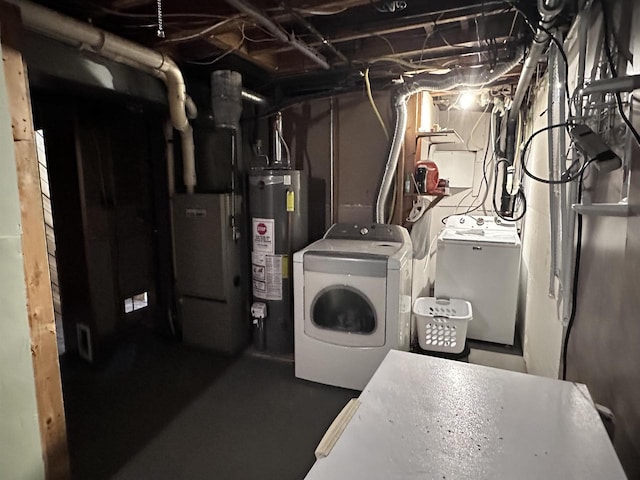 6111 Magnolia Dr, Wisconsin Rapids, WI 54494 - unfinished below grade area with gas water heater, washer and dryer, and heating unit