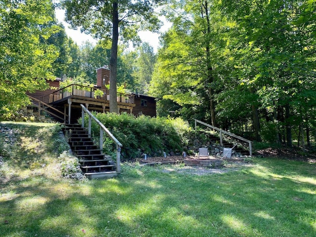 7002 Wildwood Ln, Rhinelander, WI 54501 - view of grassy yard with stairway and a deck
