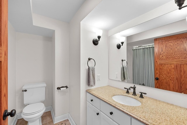 N51W15940 Fair Oak Pkwy, Menomonee Falls, WI 53051 - full bathroom featuring toilet, vanity, and baseboards