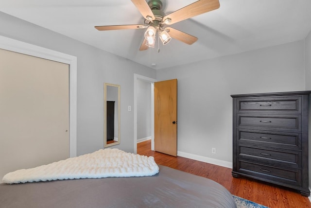N51W15940 Fair Oak Pkwy, Menomonee Falls, WI 53051 - bedroom featuring baseboards, wood finished floors, and ceiling fan