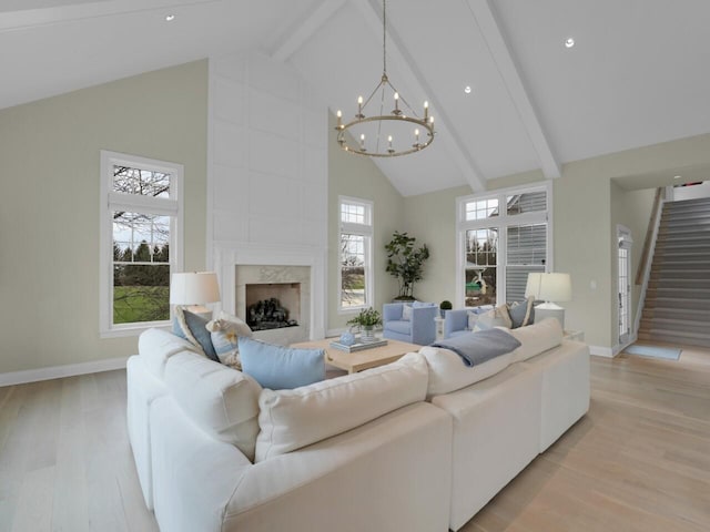 5021 Sherwood Ct, Burlington, WI 53105 - living area featuring high vaulted ceiling, a chandelier, baseboards, light wood-style floors, and beam ceiling