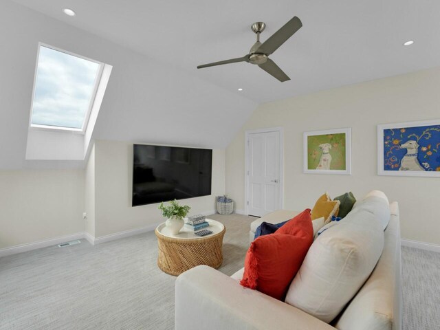 5021 Sherwood Ct, Burlington, WI 53105 - carpeted living room featuring a skylight, lofted ceiling, recessed lighting, baseboards, and ceiling fan