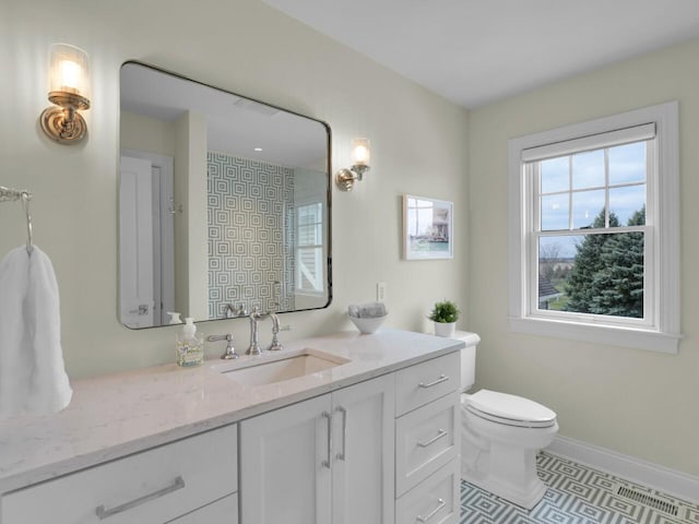 5021 Sherwood Ct, Burlington, WI 53105 - bathroom featuring vanity, toilet, tile patterned floors, and baseboards