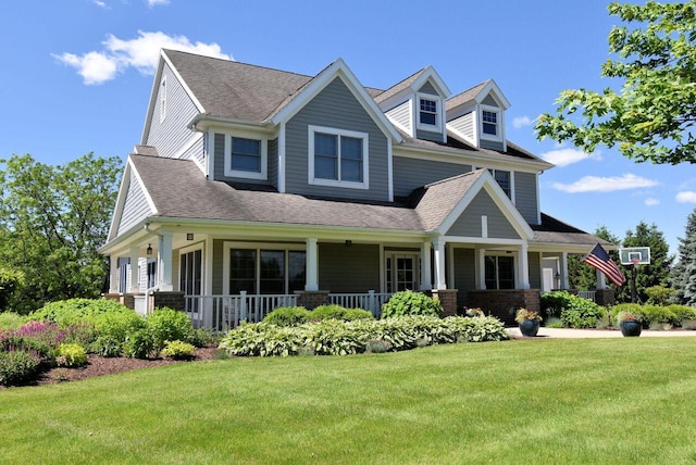 5021 Sherwood Ct, Burlington, WI 53105 - view of front facade featuring a front yard, covered porch, and a shingled roof