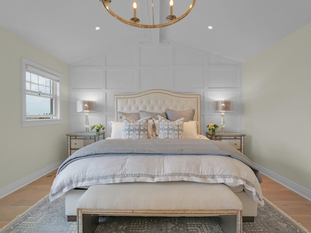 5021 Sherwood Ct, Burlington, WI 53105 - bedroom with a chandelier, baseboards, and wood finished floors