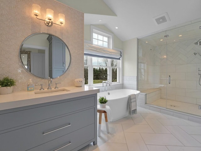 5021 Sherwood Ct, Burlington, WI 53105 - bathroom featuring lofted ceiling, vanity, a shower stall, a soaking tub, and wallpapered walls