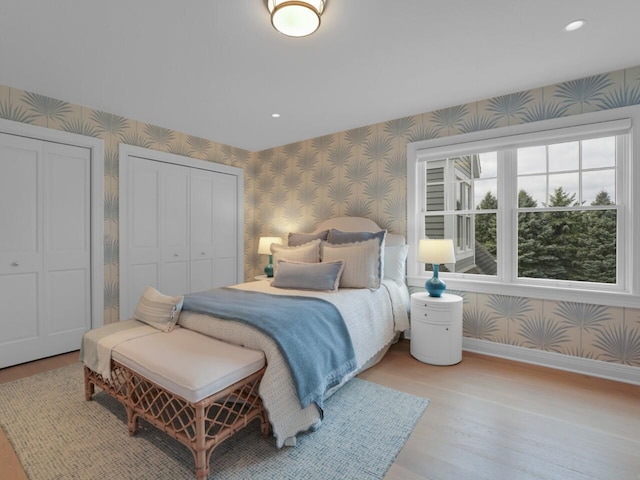 5021 Sherwood Ct, Burlington, WI 53105 - bedroom with wallpapered walls, baseboards, wood finished floors, and recessed lighting
