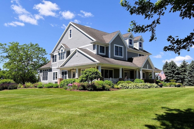 5021 Sherwood Ct, Burlington, WI 53105 - view of front facade with a front yard, a porch, and roof with shingles