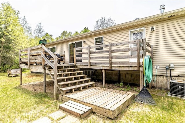 W14312 Montgomery Rd, Hixton, WI 54635 - back of property featuring a deck and central air condition unit