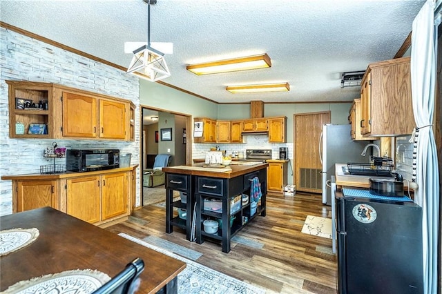 W14312 Montgomery Rd, Hixton, WI 54635 - kitchen featuring open shelves, a textured ceiling, dark wood-style floors, ornamental molding, and tasteful backsplash