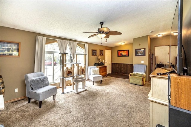 W14312 Montgomery Rd, Hixton, WI 54635 - sitting room featuring a textured ceiling, carpet floors, and ceiling fan