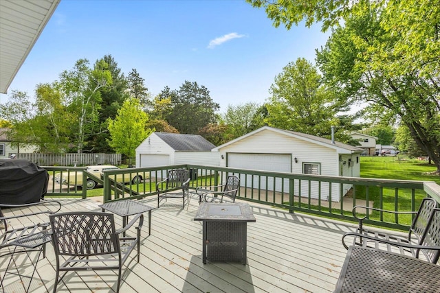 1941 Beulah Ave, East Troy, WI 53120 - deck with a detached garage, an outdoor structure, and grilling area