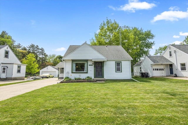 1941 Beulah Ave, East Troy, WI 53120 - bungalow-style home featuring a front lawn, an attached garage, and roof with shingles