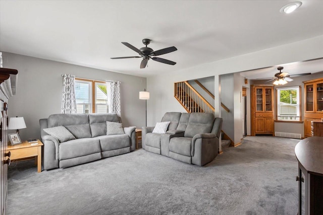1941 Beulah Ave, East Troy, WI 53120 - living area featuring ceiling fan, carpet flooring, and stairs