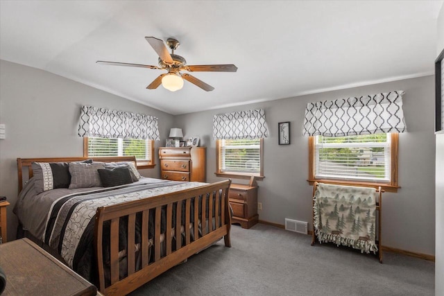 1941 Beulah Ave, East Troy, WI 53120 - bedroom featuring multiple windows, lofted ceiling, baseboards, light carpet, and ceiling fan