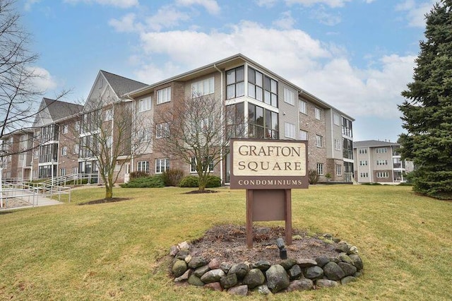 2142 Chateau Ct Unit 308-2, Grafton, WI 53024 - community sign with a lawn