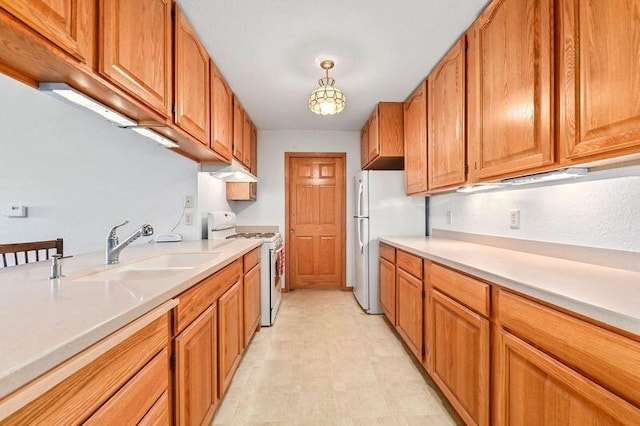 2142 Chateau Ct Unit 308-2, Grafton, WI 53024 - kitchen featuring white appliances, light flooring, under cabinet range hood, and light countertops