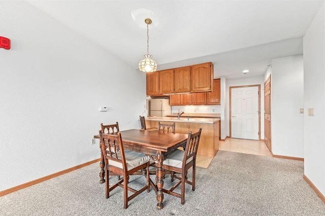 2142 Chateau Ct Unit 308-2, Grafton, WI 53024 - dining area featuring baseboards and light colored carpet