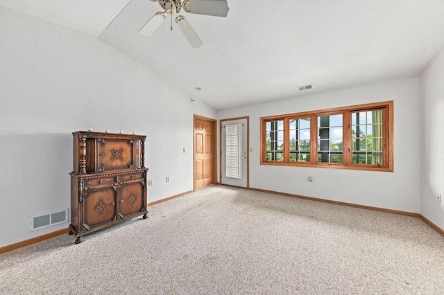 2142 Chateau Ct Unit 308-2, Grafton, WI 53024 - unfurnished living room featuring carpet flooring, lofted ceiling, baseboards, and a ceiling fan