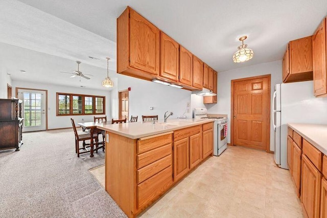 2142 Chateau Ct Unit 308-2, Grafton, WI 53024 - kitchen featuring white appliances, ceiling fan, light countertops, and open floor plan