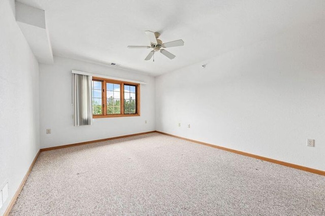 2142 Chateau Ct Unit 308-2, Grafton, WI 53024 - unfurnished room featuring a ceiling fan, light colored carpet, and baseboards