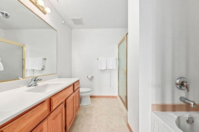 2142 Chateau Ct Unit 308-2, Grafton, WI 53024 - bathroom featuring an enclosed shower, a tub to relax in, vanity, toilet, and baseboards
