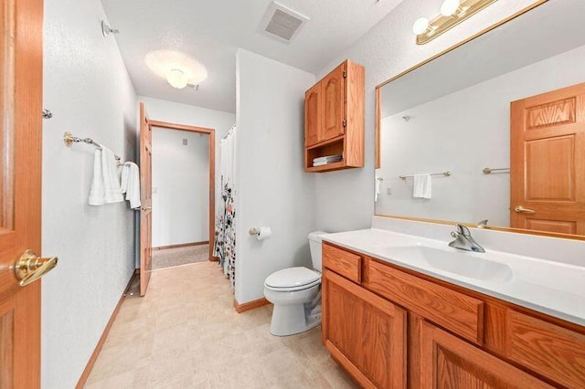 2142 Chateau Ct Unit 308-2, Grafton, WI 53024 - full bathroom with toilet, vanity, and baseboards