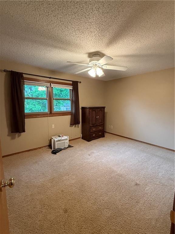 51 Stump Lake Rd, Chippewa Falls, WI 54729 - spare room featuring ceiling fan, light colored carpet, a textured ceiling, and baseboards
