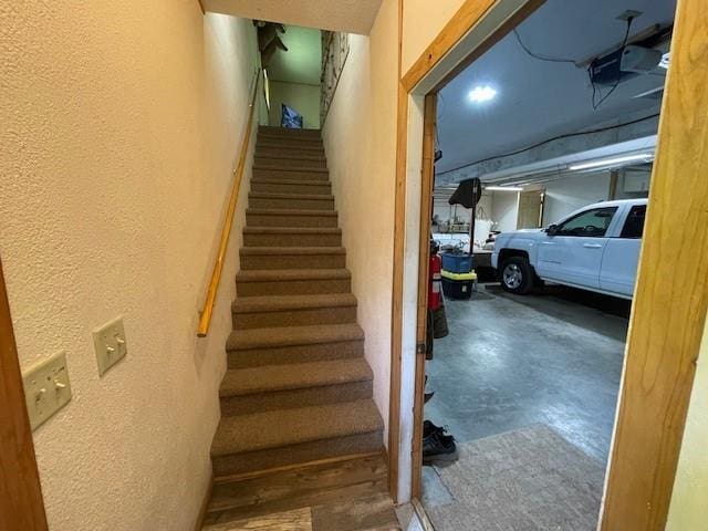 4546 Gold Leaf Ln, Ojibwa, WI 54862 - staircase with a textured wall and finished concrete floors