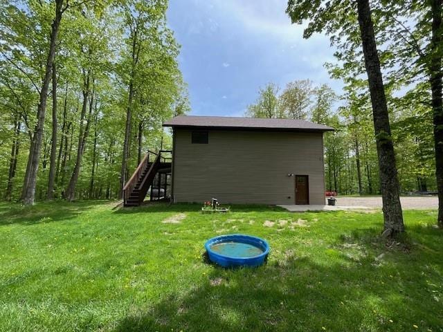 4546 Gold Leaf Ln, Ojibwa, WI 54862 - rear view of house with stairway and a yard