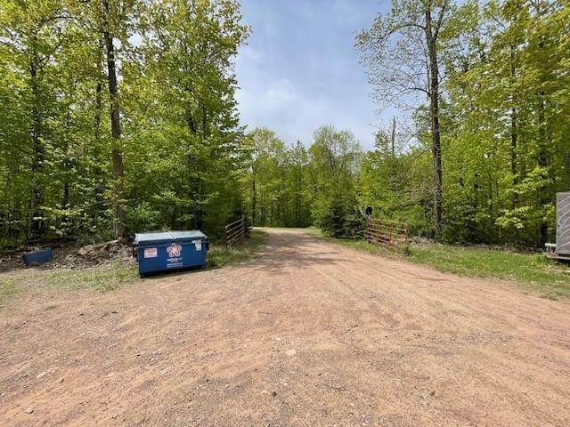 4546 Gold Leaf Ln, Ojibwa, WI 54862 - view of dirt / gravel road featuring a wooded view