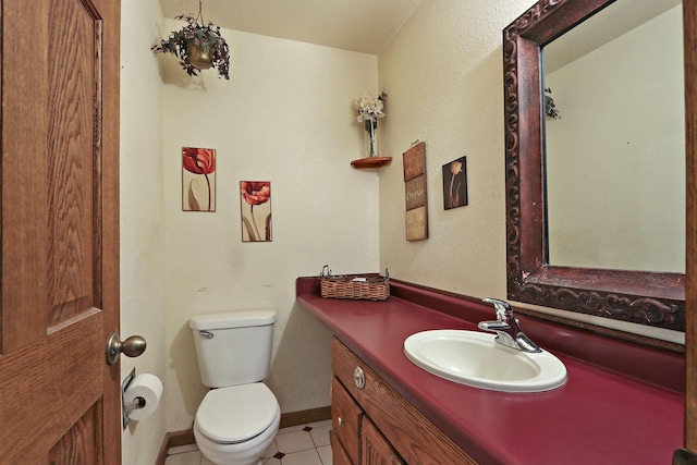 N7094 Evergreen Ln, Elkhorn, WI 53121 - bathroom with toilet, vanity, tile patterned floors, and baseboards