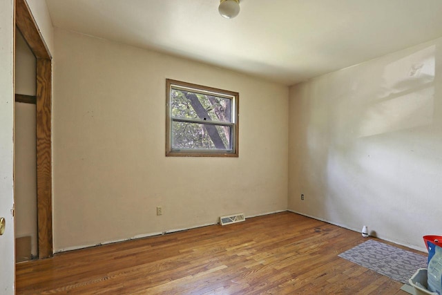 N7094 Evergreen Ln, Elkhorn, WI 53121 - unfurnished bedroom featuring wood finished floors