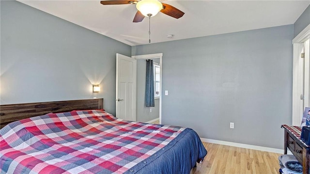 3312 White Oak Ln, Eau Claire, WI 54703 - bedroom featuring wood finished floors, baseboards, and ceiling fan