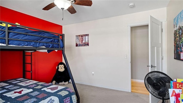 3312 White Oak Ln, Eau Claire, WI 54703 - carpeted bedroom with ceiling fan and baseboards