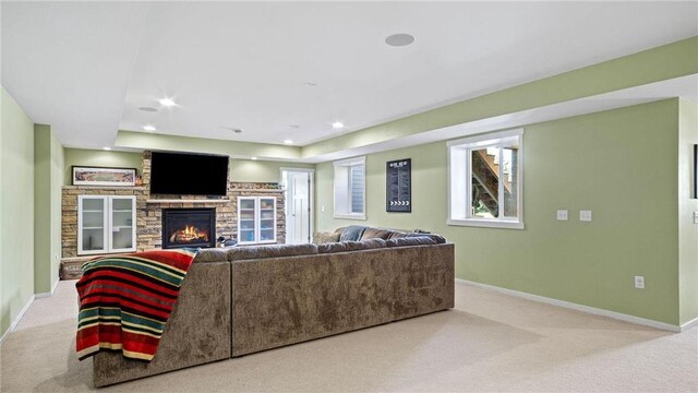 3312 White Oak Ln, Eau Claire, WI 54703 - carpeted living room featuring baseboards, a stone fireplace, and recessed lighting