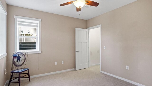 3312 White Oak Ln, Eau Claire, WI 54703 - unfurnished bedroom featuring carpet floors, baseboards, and a ceiling fan
