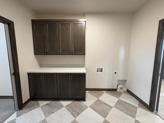 733 Tambour Ct, De Pere, WI 54115 - laundry area featuring cabinet space, washer hookup, electric dryer hookup, and baseboards