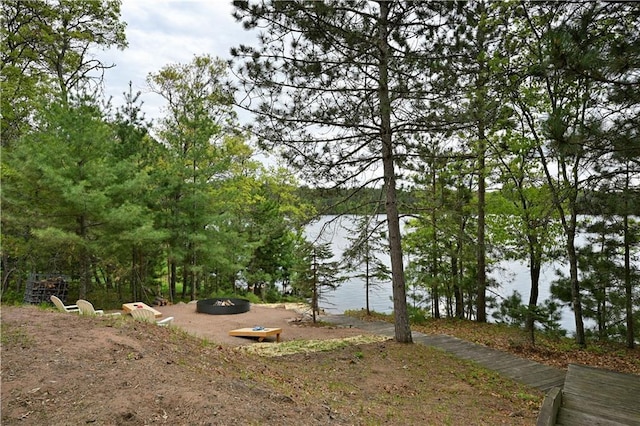 W7607 Whitetail Dr, Minong, WI 54859 - view of yard featuring a fire pit and a water view