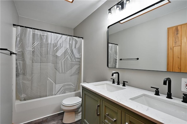 W7607 Whitetail Dr, Minong, WI 54859 - bathroom with toilet, double vanity, shower / tub combo with curtain, and wood finished floors