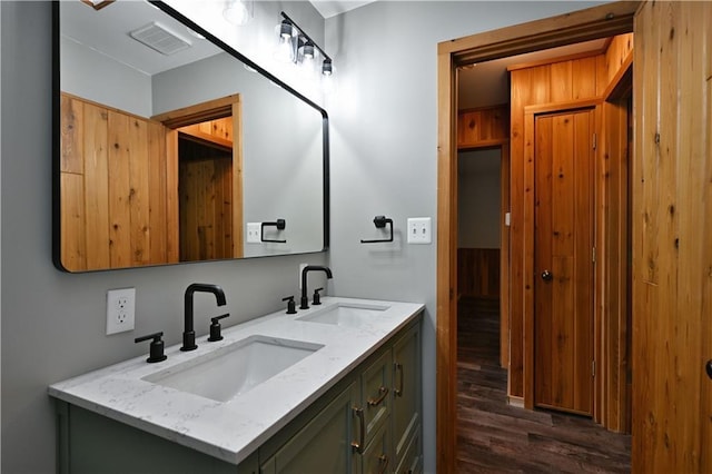 W7607 Whitetail Dr, Minong, WI 54859 - full bathroom featuring wood finished floors and double vanity