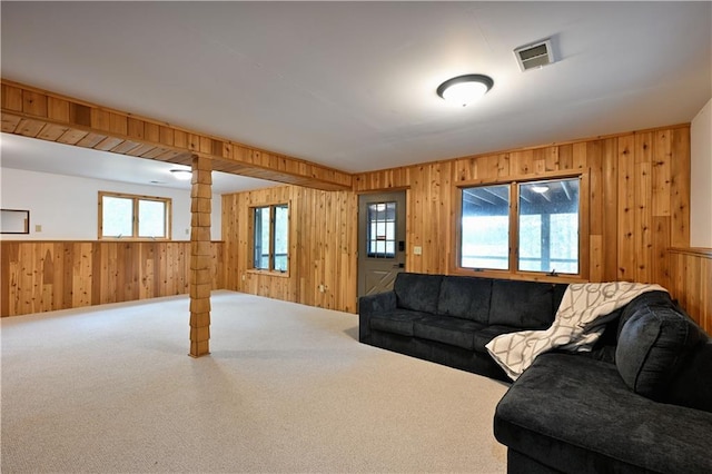 W7607 Whitetail Dr, Minong, WI 54859 - living room featuring wood walls, carpet floors, and wainscoting