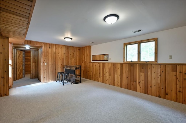 W7607 Whitetail Dr, Minong, WI 54859 - below grade area featuring wooden walls, carpet flooring, and a wainscoted wall
