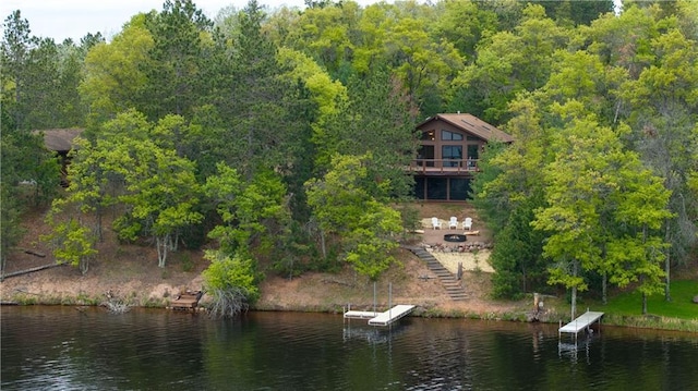 W7607 Whitetail Dr, Minong, WI 54859 - view of subject property with a nearby body of water and a forest