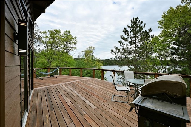 W7607 Whitetail Dr, Minong, WI 54859 - wooden terrace featuring a water view and outdoor dining area