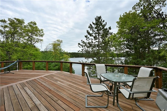 W7607 Whitetail Dr, Minong, WI 54859 - deck featuring outdoor dining area and a water view